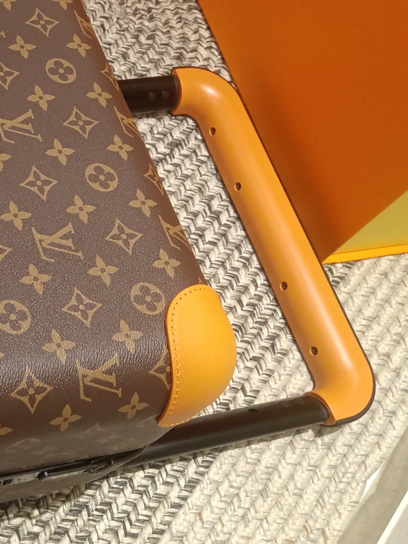 Brown Monogram Pattern Spinner Suitcase with Orange Leather Trim