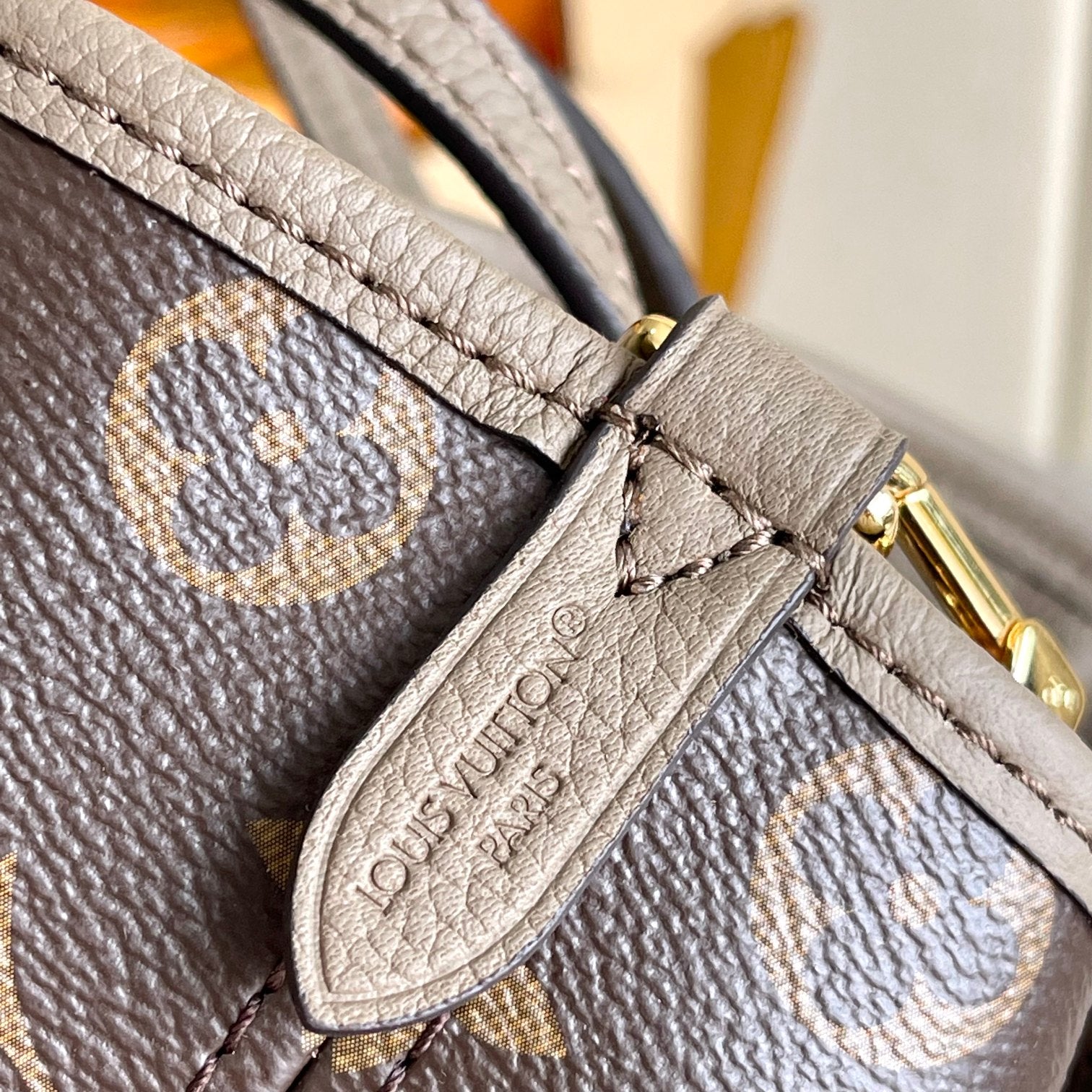 Louis Vuitton Taupe Leather Bucket Handbag with Top Handles and Shoulder Strap