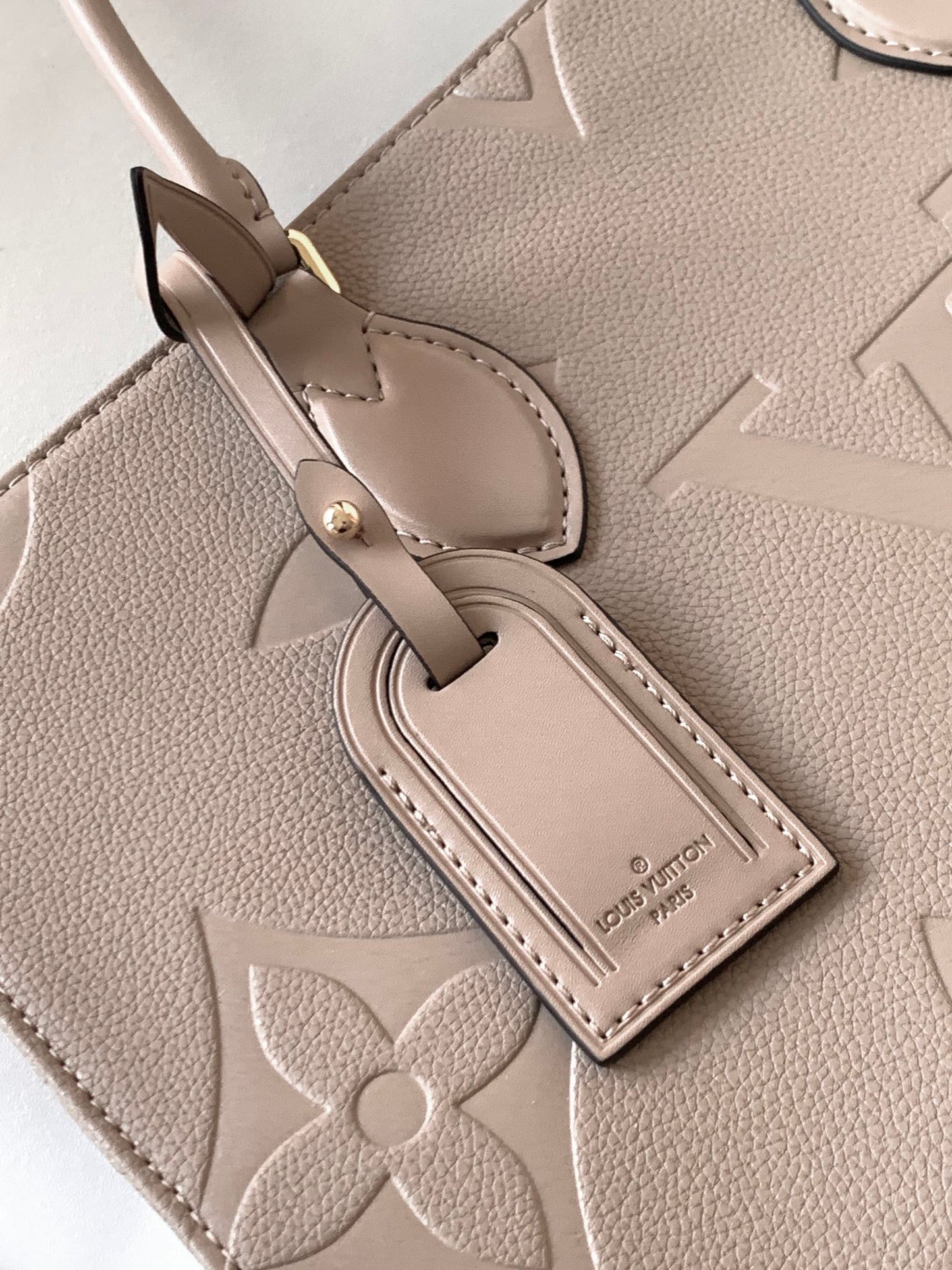 Louis Vuitton Elegant Taupe Embossed Leather Tote Bag with Top Handles